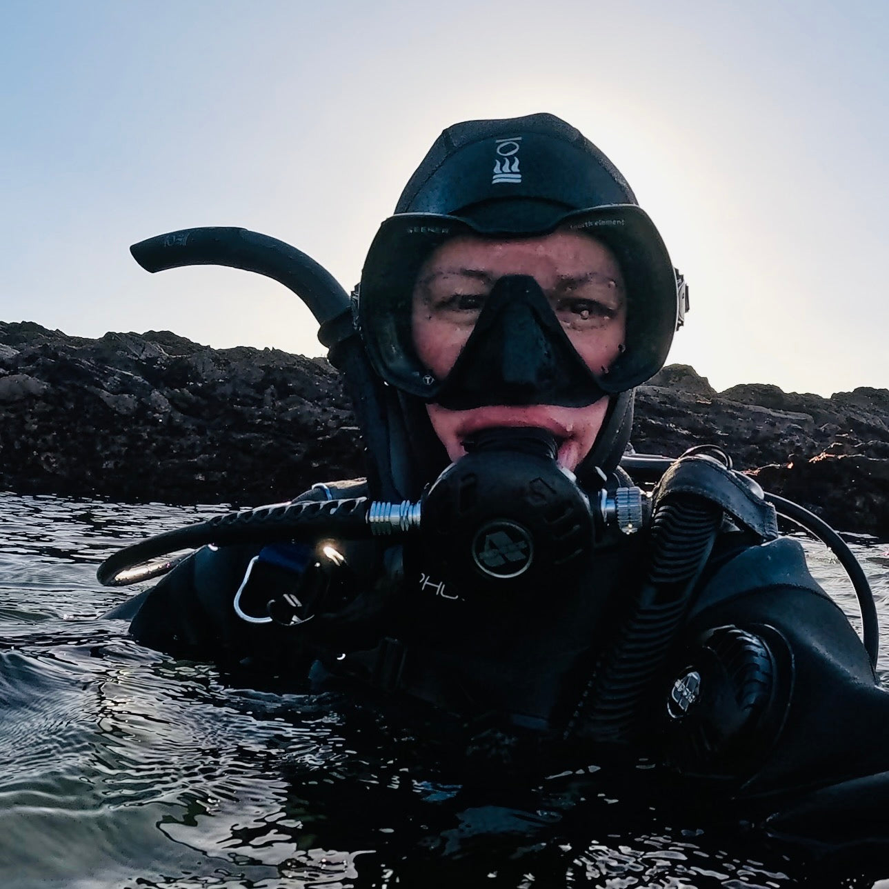 PADI instructor in scuba diving gear underwater fourth element apex aqualung